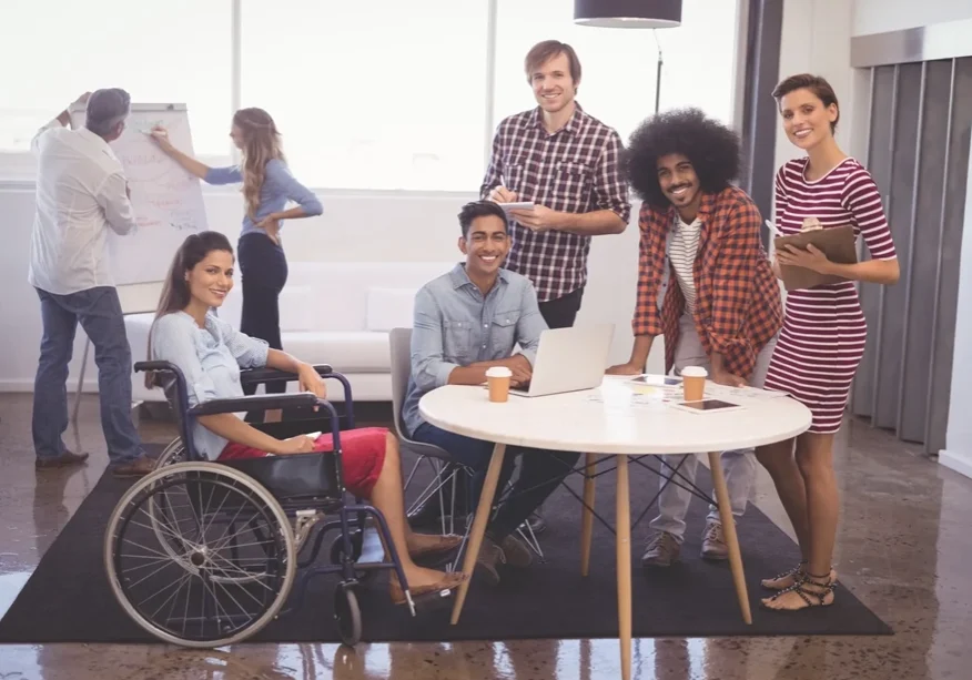 A group of people that are sitting around a table.